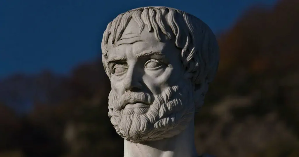 A detailed bust of a bearded man, representing Aristotle's education and his influence on philosophy and learning.